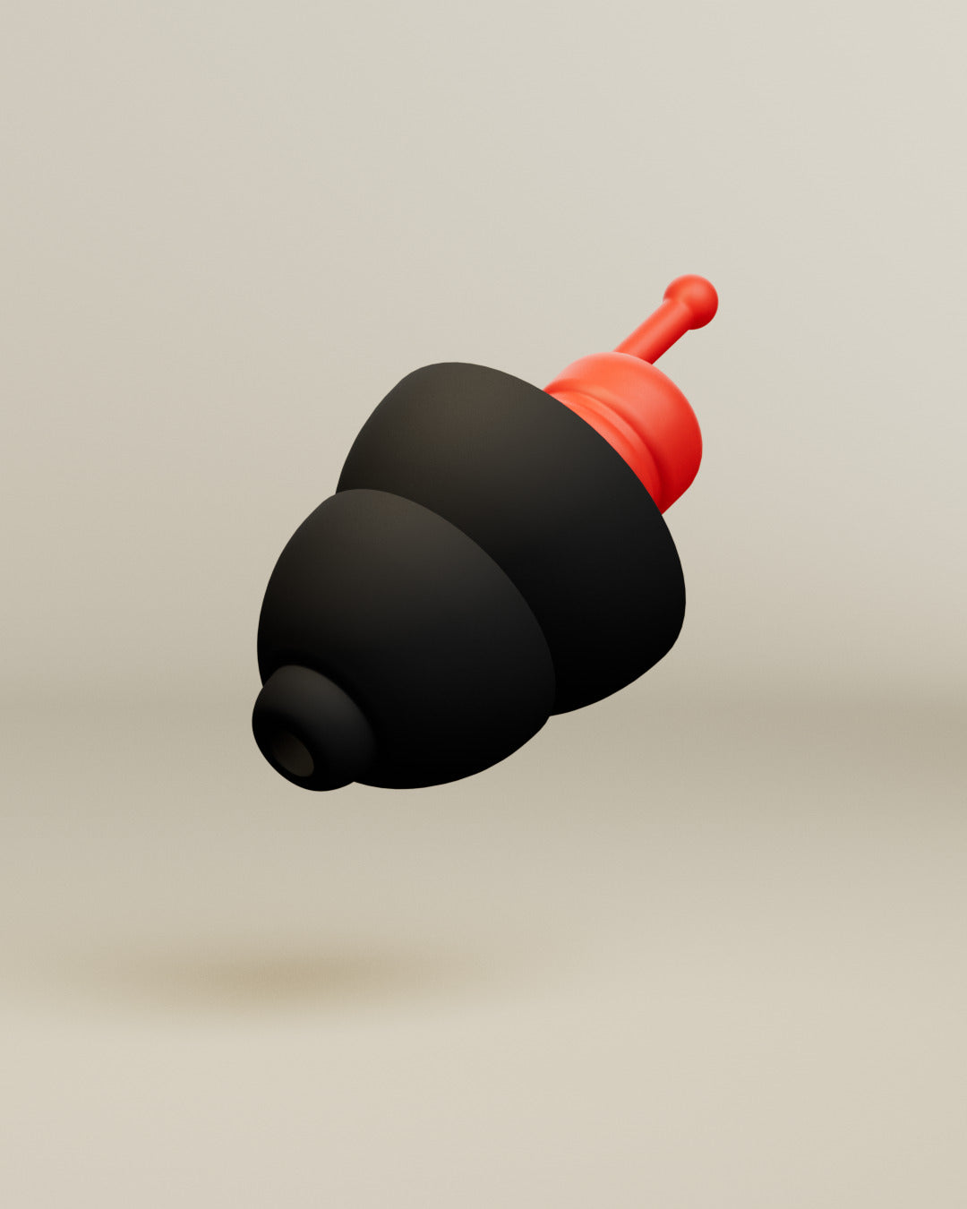 Alpine MotoGP™ earplug, 3D render of a single black earplug with red filter and stem on a beige background 